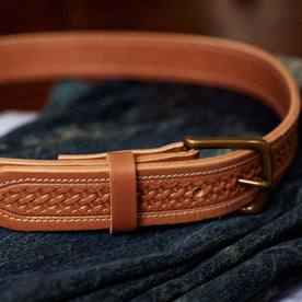 editorial image of The Tooled Belt in Saddle Tan clasped