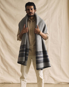 fit model with The Wool Blanket in Bay Stripe around his shoulders, Accessories by Taylor Stitch