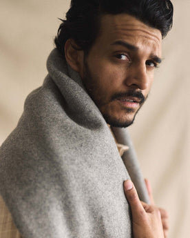 fit model posing with The Wool Blanket in Bay Stripe, Accessories by Taylor Stitch