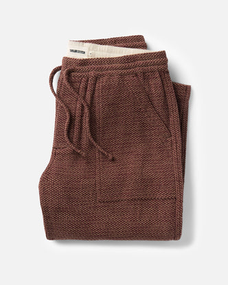 folded flatlay of The Breakwater Pant in Black Cherry Sashiko
