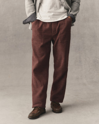 fit model sitting in The Breakwater Pant in Black Cherry Sashiko