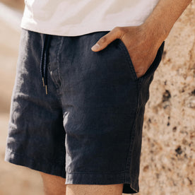 fit model standing with his hand in the pocket of The Apres Short in Granite Hemp