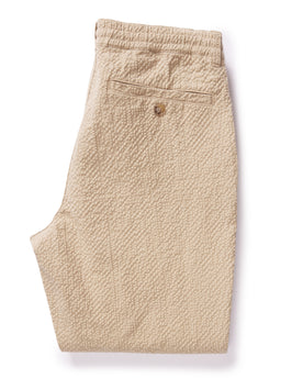 flatlay of The Easy Pant in Heather Oat Seersucker, shown folded from the back, Bottoms by Taylor Stitch
