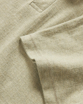 material shot of the sleeve on The Herringbone Polo in Heather Sage, Knits by Taylor Stitch
