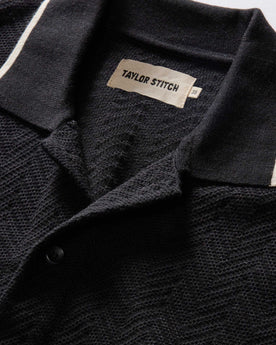 material shot of the collar on The Button Down Polo in Coal Herringbone, Knits by Taylor Stitch