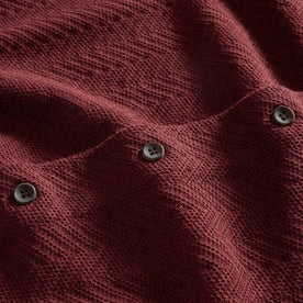 material shot of the buttons on The Button Down Polo in Dried Cherry Herringbone