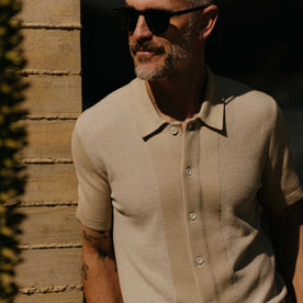 fit model showing off texture on The Button Down Polo in Faded Khaki Seed Stitch