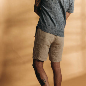 fit model showing the back of The Easy Short in Natural Linen