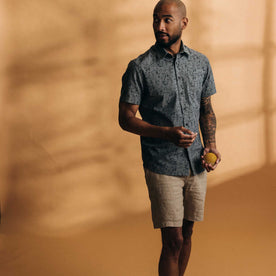 fit model standing wearing The Easy Short in Natural Linen