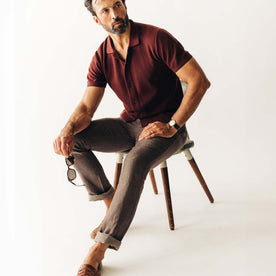 fit model sitting on a stool wearing The Easy Pant in Cocoa Linen