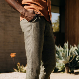 fit model with his hand in his pocket wearing The Easy Pant in Olive Linen