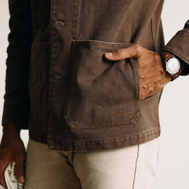 fit model with his hand in his pocket wearing The Fremont Jacket in Aged Penny Chipped Canvas