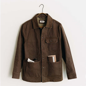 editorial image of The Fremont Jacket in Aged Penny Chipped Canvas on a hanger