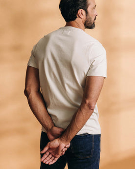 fit model showing off the back of The Heavy Bag Tee in Natural, Knits by Taylor Stitch