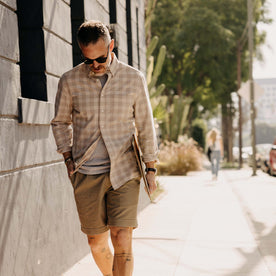 fit model walking wearing The Jack in Heather Flax Plaid