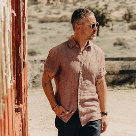 fit model with his hand in his pocket wearing The Short Sleeve California in Dried Cherry Hemp