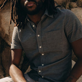 fit model showing off the front of The Short Sleeve California in Heather Slate Cord