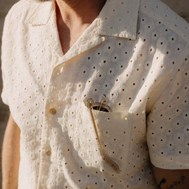fit model showing off the pocket on The Short Sleeve Hawthorne in Vintage White Embroidered Eyelet