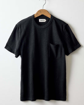 editorial image of The Organic Cotton Tee in Black Indigo hanging, Knits by Taylor Stitch