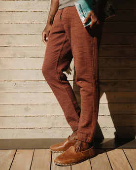 fit model walking with his hands in the pockets of The Apres Pant in Black Cherry Sashiko, Bottoms by Taylor Stitch