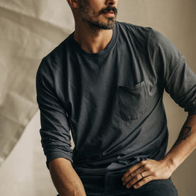 fit model sitting wearing The Cotton Hemp Long Sleeve Tee in Charcoal