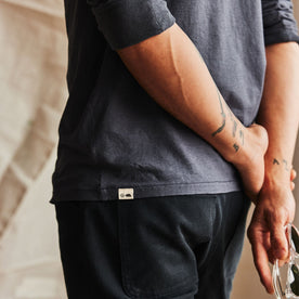 fit model showing off details on The Cotton Hemp Long Sleeve Tee in Navy