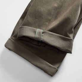material shot of the selvage cuffs on The Democratic All Day Pant in Fatigue Olive Selvage Denim