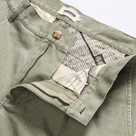 material shot of the waistband on The Matlow Pant in Dried Sage Pigment Herringbone