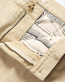 material shot of the waistband on The Matlow Pant in Light Khaki Pigment Herringbone, Bottoms by Taylor Stitch