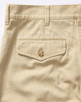 material shot of the back pocket on The Matlow Pant in Light Khaki Pigment Herringbone, Bottoms by Taylor Stitch