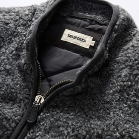 material shot of the collar on The Port Vest in Coal Marl Boucle Fleece