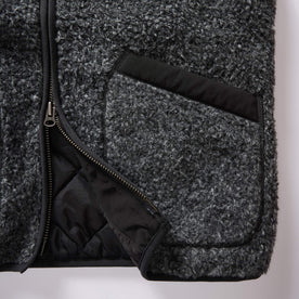 material shot of the zipper and pockets on The Port Vest in Coal Marl Boucle Fleece