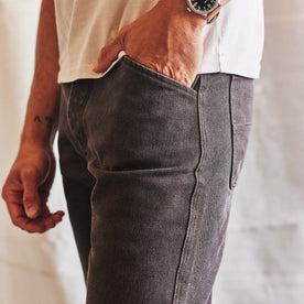 fit model with his hand in his pocket wearing The Camp Pant in Soil Chipped Canvas