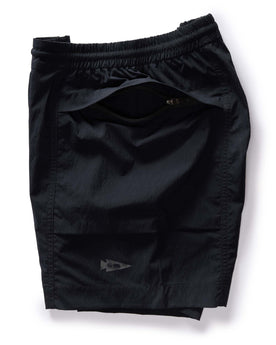 material shot of the hidden zipper pocket on The Challenge Cargo Short in Black, Bottoms by Taylor Stitch