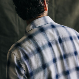 fit model showing the back yoke on The Frontier Shirt in Indigo Shadow Plaid