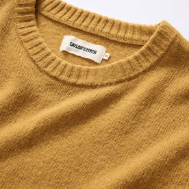 material shot of ribbed neck opening on The Lodge Sweater in Gold