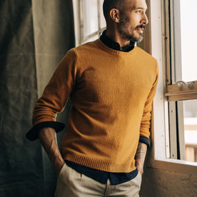 fit model wearing The Lodge Sweater in Gold with a shirt