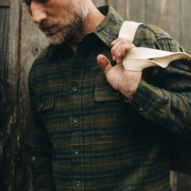fit model showing the front flap chest pockets on The Yosemite Shirt in Dark Forest Plaid