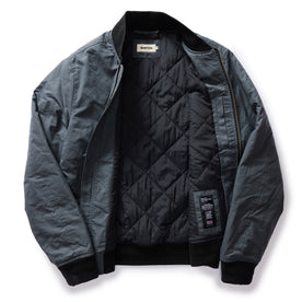 flatlay lay of The Bomber Jacket in Charcoal Dry Wax, shown open
