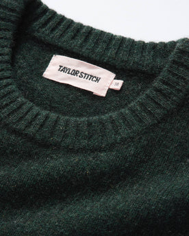 material shot of the ribbed neck opening on The Lodge Sweater in Black Pine, Knits by Taylor Stitch