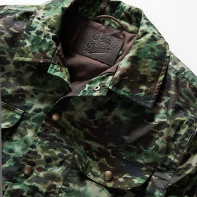 material shot of the collar and TS x Danner embossed patch on The Venture Jacket in Painted Camo Waxed Canvas