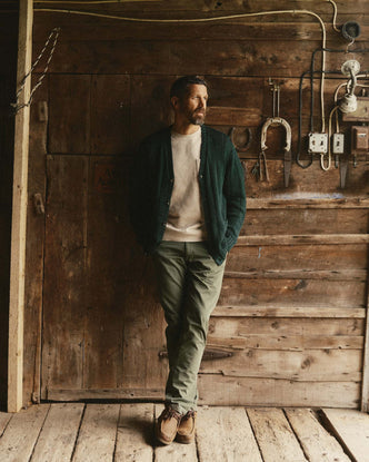 fit model posing in The Democratic Foundation Pant in Organic Smoked Olive