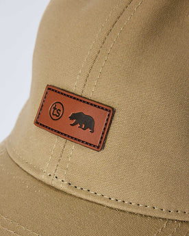 editorial image of the tag on The Pathfinder Cap in Khaki Dry Wax, Accessories by Taylor Stitch