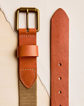 editorial flatlay of the buckle and end The Webbed Belt in Whiskey, Accessories by Taylor Stitch