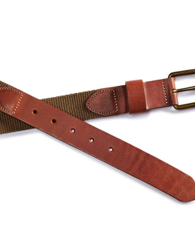editorial flatlay of the buckle and belt holes on The Webbed Belt in Whiskey, Accessories by Taylor Stitch