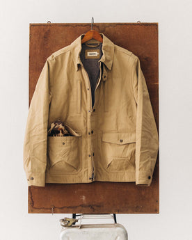 editorial image of The Pathfinder Jacket in Khaki Dry Wax hanging, Outerwear by Taylor Stitch