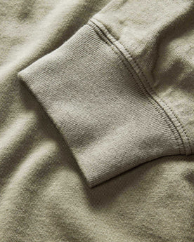 material shot of the sleeves on The Organic Cotton Henley in Sage, Knits by Taylor Stitch