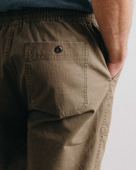 fit model showing off the back pocket on The Breakwater Pant in Mushroom Ripstop, Bottoms by Taylor Stitch