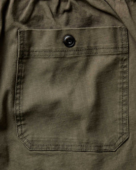 material shot of the back pocket on The Breakwater Pant in Mushroom Ripstop, Bottoms by Taylor Stitch