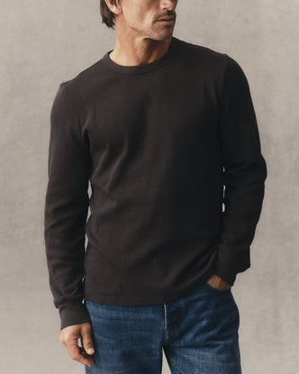 fit model showing off the sleeve on The Organic Cotton Crew in Faded Black Waffle